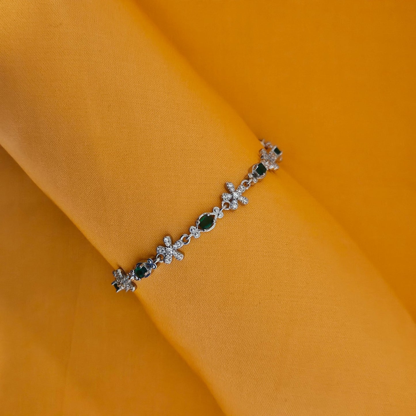 flower motif and green stone bracelet
