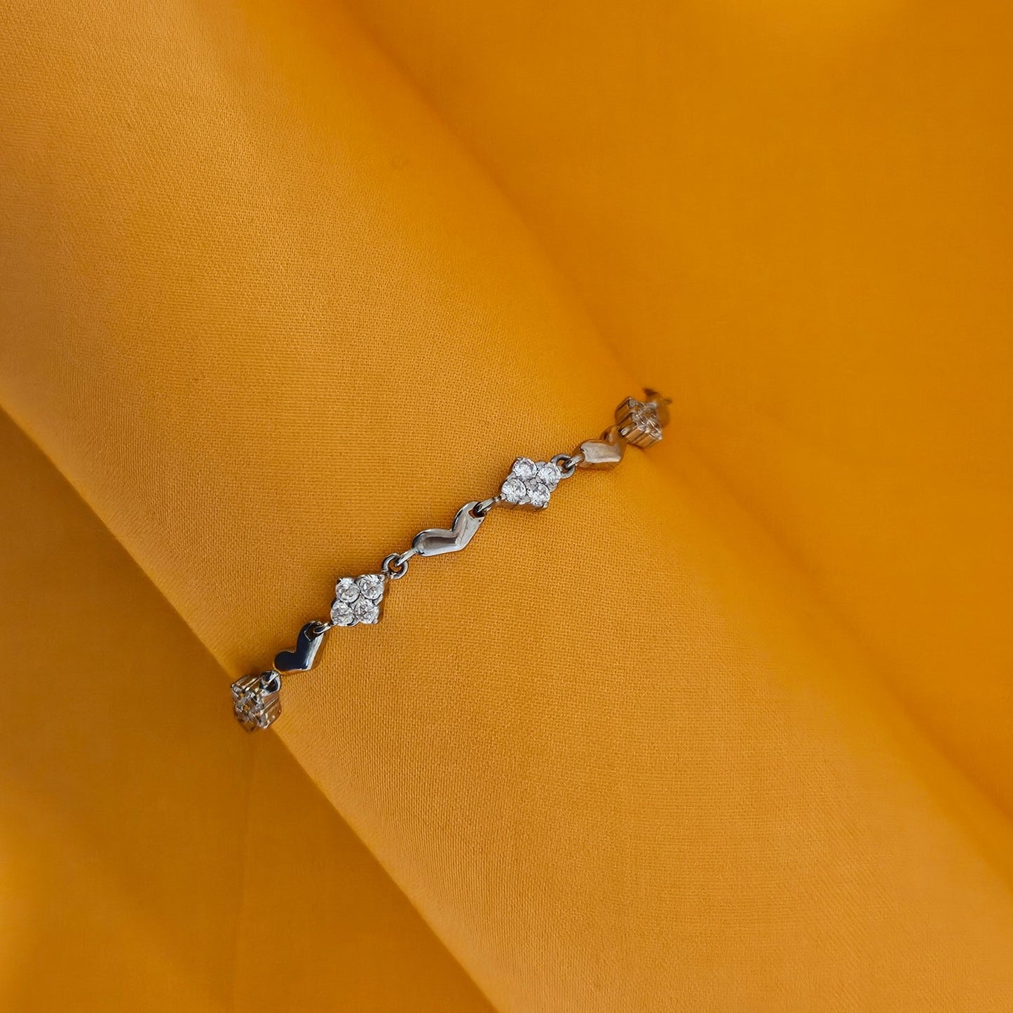 Diamond shaped motifs with heart shaped motifs bracelet