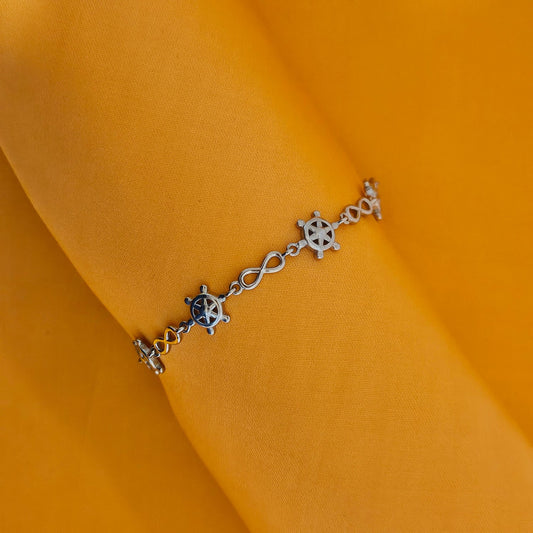 Ship wheel with infinity motif bracelet