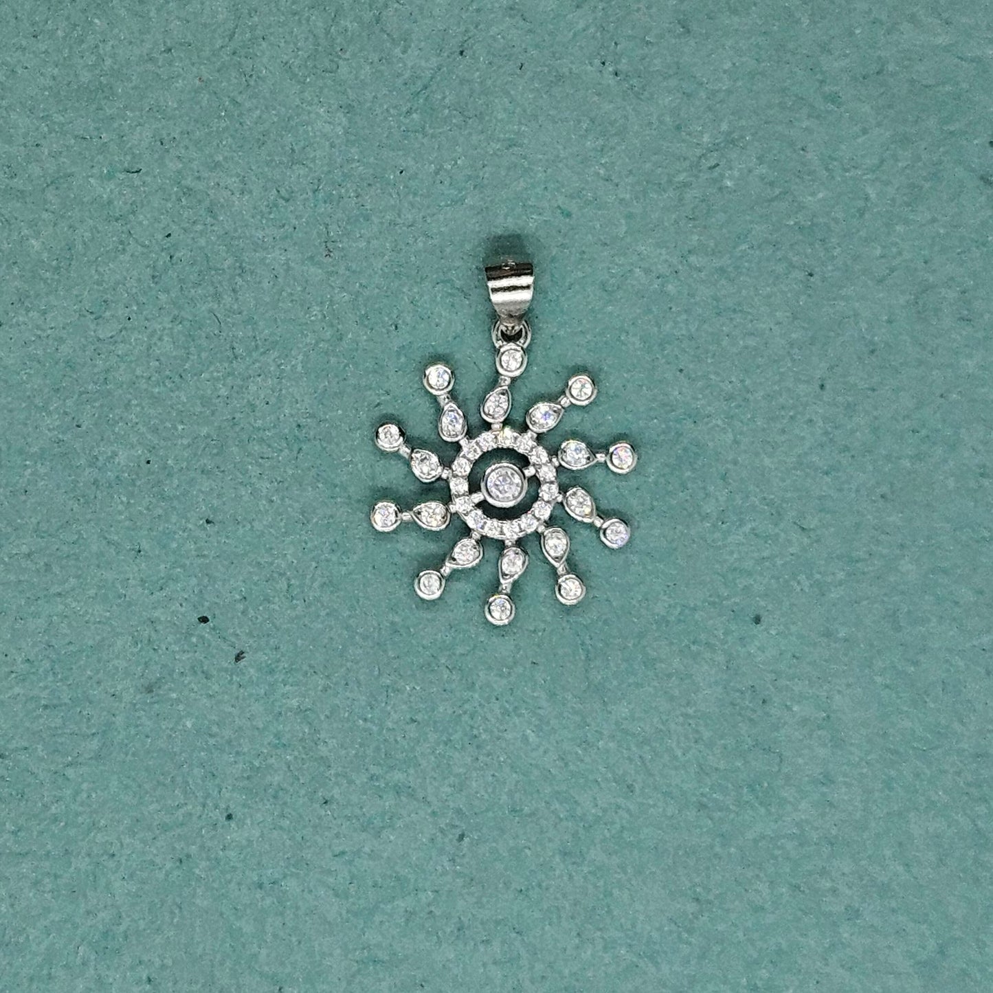 Concentric circle pendant with sun rays