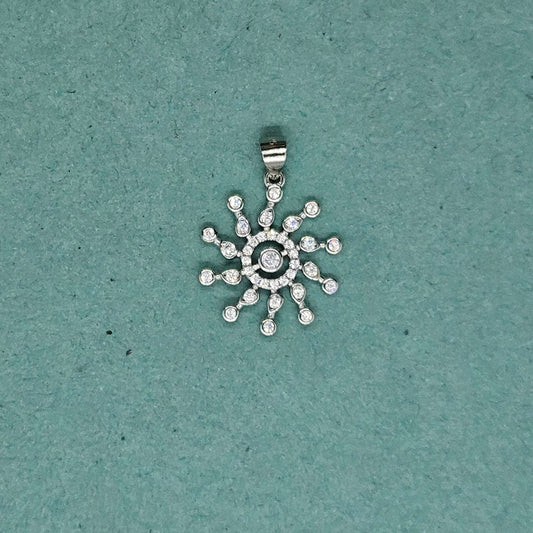 Concentric circle pendant with sun rays